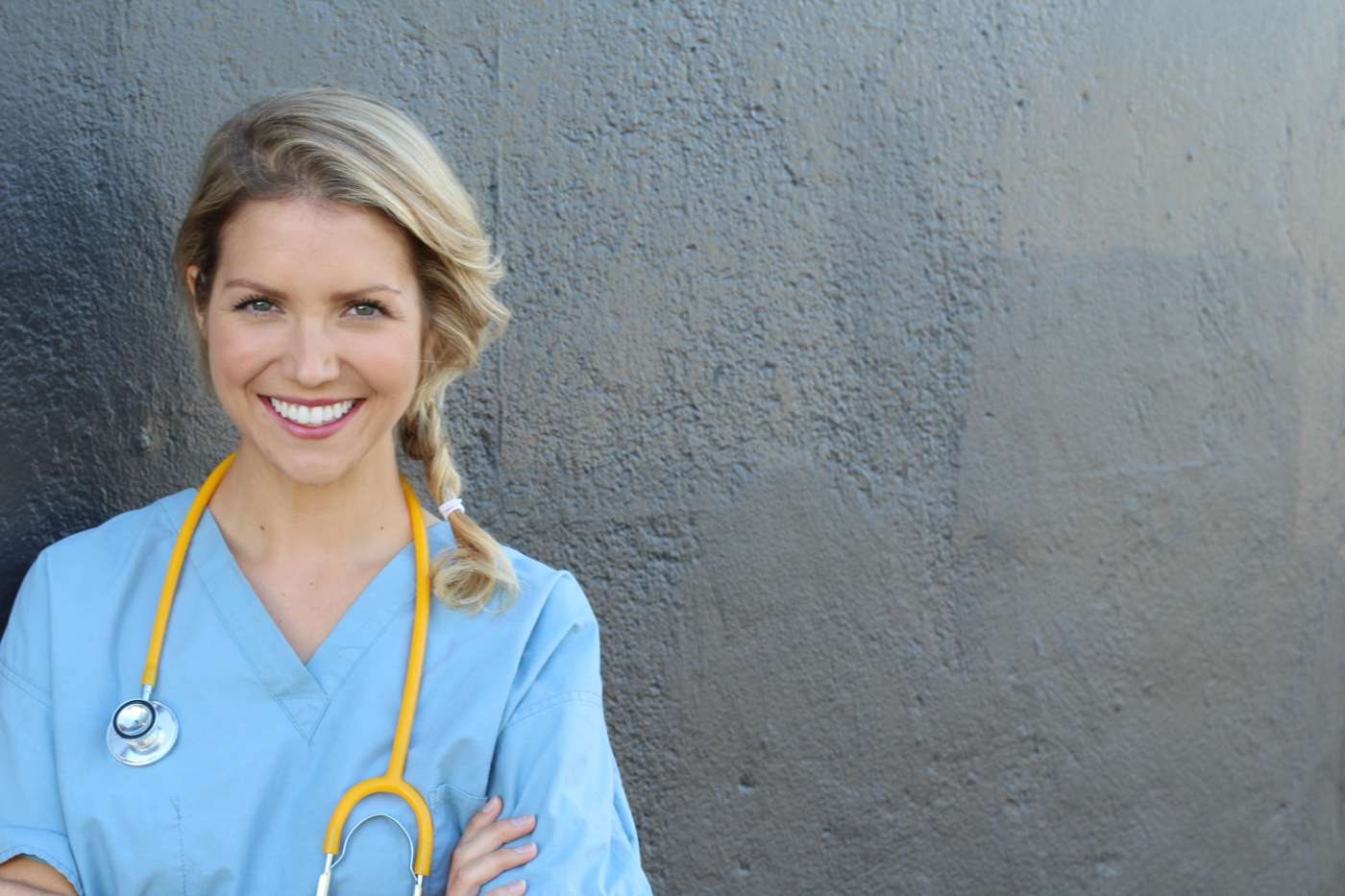 A nurse smiling at the camera